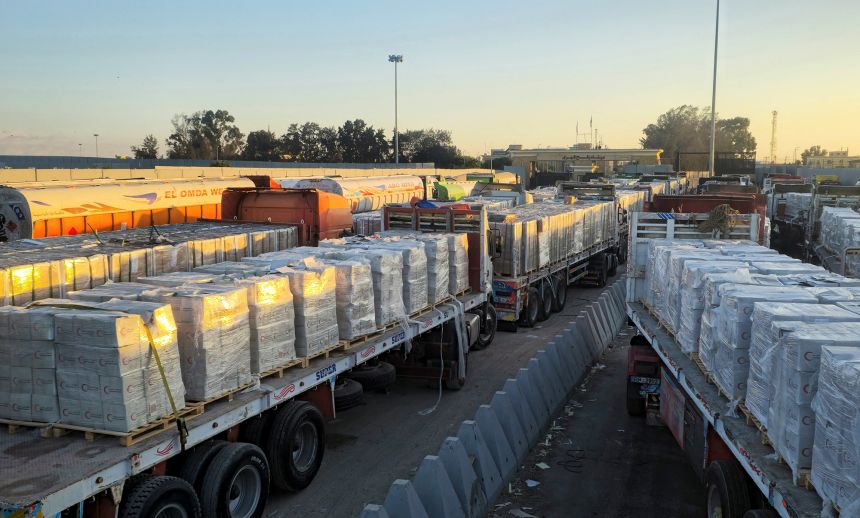Trucks carrying humanitarian aid line up at the Rafah border on the Egyptian side and enter the crossing into the Gaza Strip, after a ceasefire between Israel and Hamas in Gaza went into effect, in Rafah, Egypt, October 16, 2025.