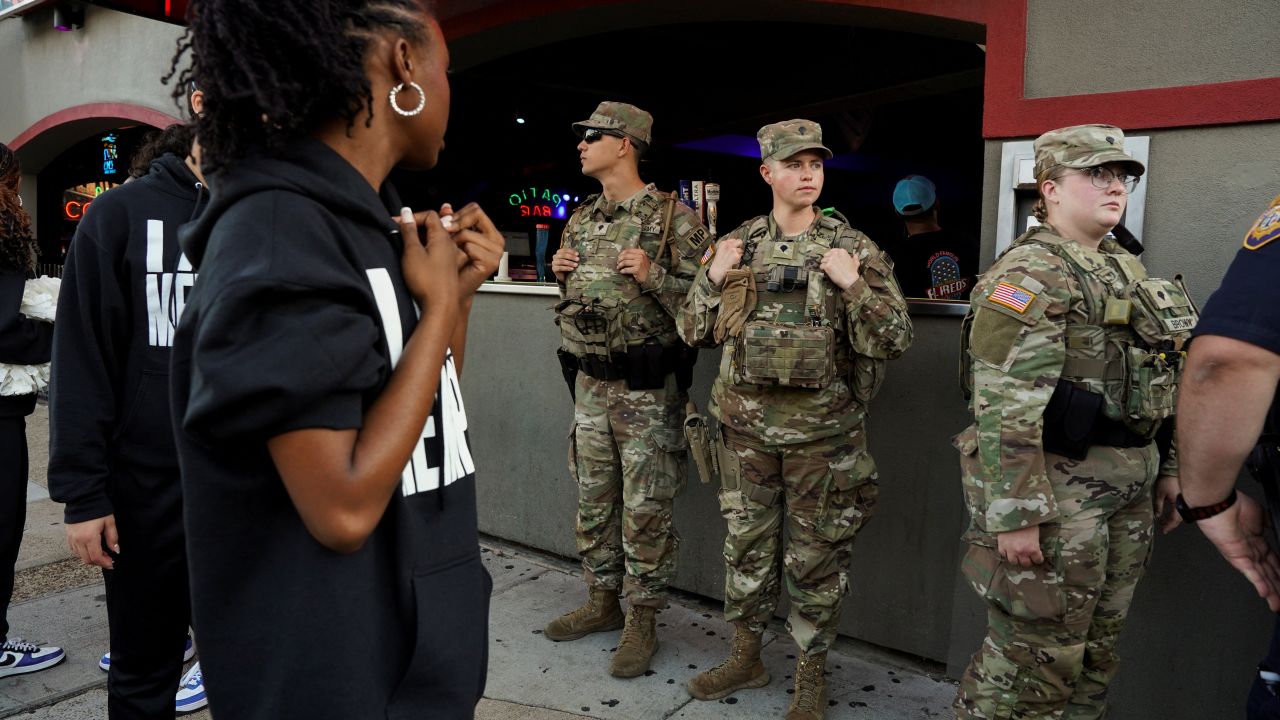 US Army National Guard members patrol in the entertainment district, Beale Street, in downtown Memphis, Tennessee, on October 16, 2025.