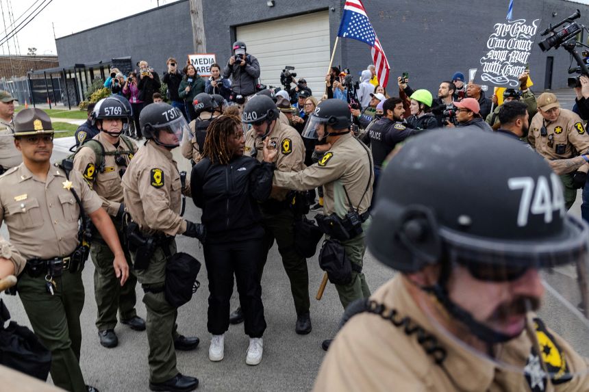 Illinois State Police arrest protester A'Keisha Lee outside of an ICE facility in Broadview, Illinois, on October 17.