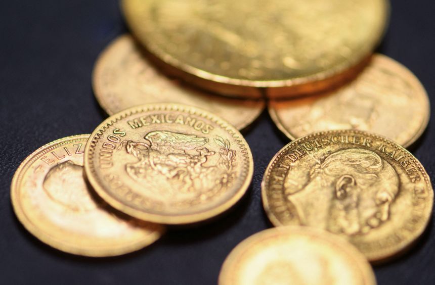 Gold coins are pictured at the local shop of goldsmith Axel Harbaum-Neuhaus in Bonn, Germany on Tuesday, as gold prices rise and many trade in their golden possessions.