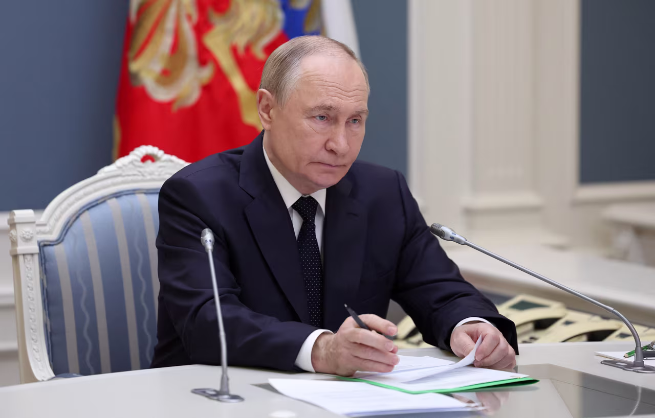 Russian President Vladimir Putin inspects a military exercise of the country's nuclear forces on land, sea and air, via a video link from Moscow on Wednesday.