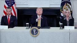 US. President Donald Trump gestures during an announcement regarding his administration's policies against cartels and human trafficking, next to Secretary of Defense Pete Hegseth and  Attorney General Pam Bondi, from the State Dining Room at the White House in Washington, DC, on Thursday.
