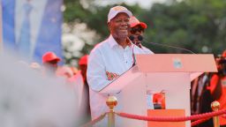 Ivorian President Alassane Ouattara, 83, addresses supporters during a final political rally.