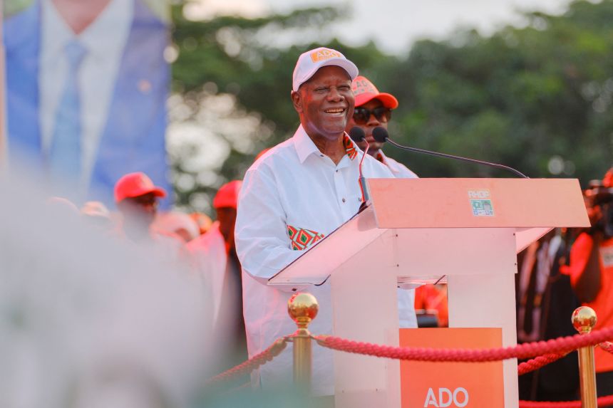 Ivorian President Alassane Ouattara, 83, addresses supporters during a final political rally.