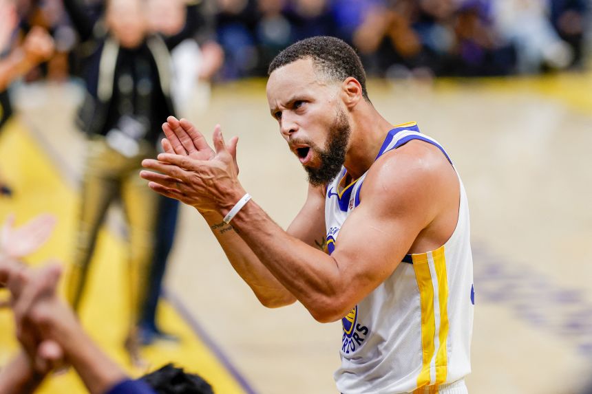 Golden State Warriors guard Stephen Curry celebrates against the Denver Nuggets.