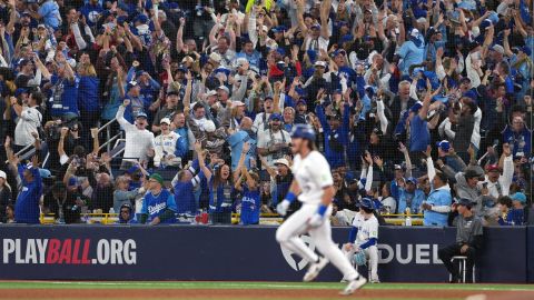 Fans celebrate as Toronto Blue Jays third baseman Addison Barger (47) runs after hitting a grand slam home run against the Los Angeles Dodgers in the sixth inning during game one of the 2025 MLB World Series at Rogers Centre on October 24, 2025.