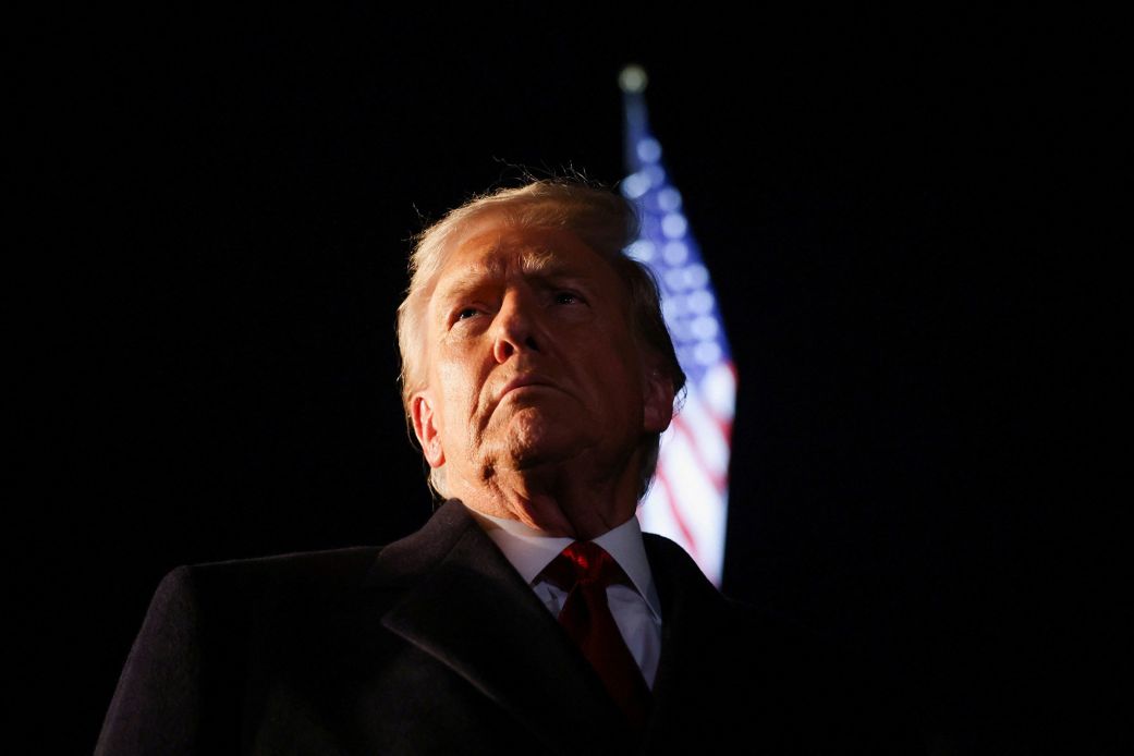 President Donald Trump looks on as he departs the White House on October 24.