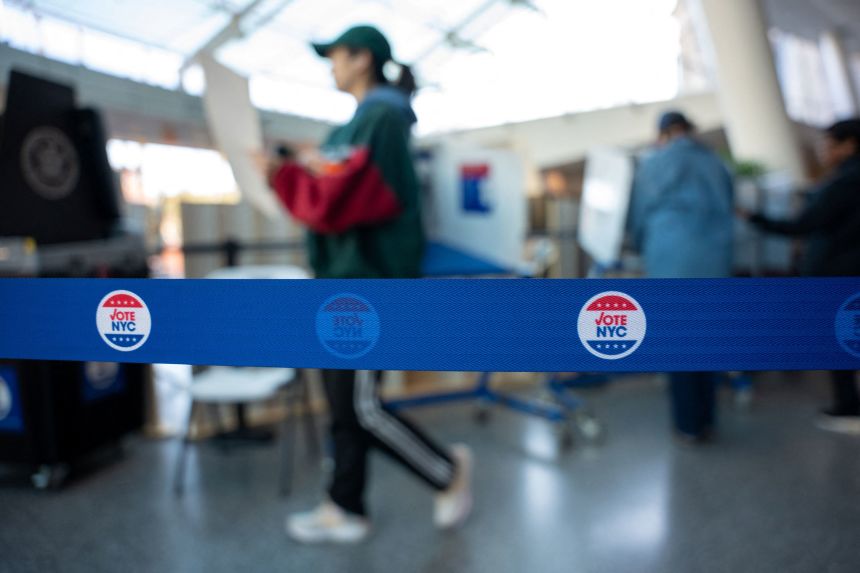 Voters cast their ballots during New York's early voting period, at a polling station in the Brooklyn Museum in New York's Brooklyn borough on October 25.