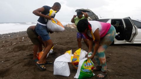 People fill bags with sand in preparation for the arrival of Hurricane Melissa, in Port Royal, Jamaica, October 26, 2025.  REUTERS/Octavio Jones