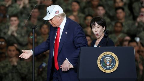 US President Donald Trump escorts Japanese Prime Minister Sanae Takaichi, after her speech on the aircraft carrier USS George Washington, during their visit to the US Navy's Yokosuka base in Yokosuka, Japan, on October 28, 2025.