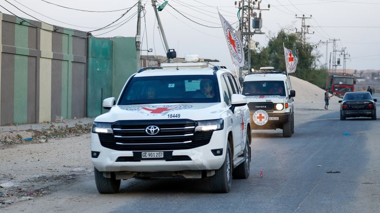 Red Cross vehicles transport the bodies of two deceased hostages after they were handed over by Hamas militants, in Deir Al-Balah, Gaza, on Thursday, October 30.