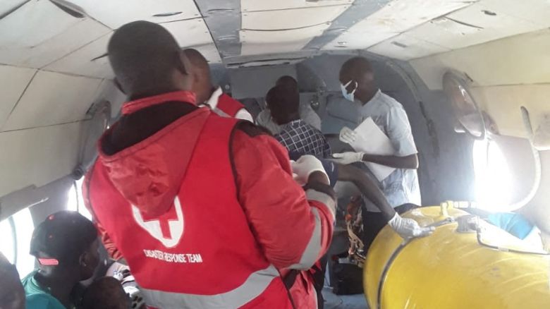 Members of the Kenya Red Cross airlift survivors of a landslide following continuous rainfall that left at least 21 people dead in Chesongoch in Elgeyo-Marakwet County in western Kenya on November 1.