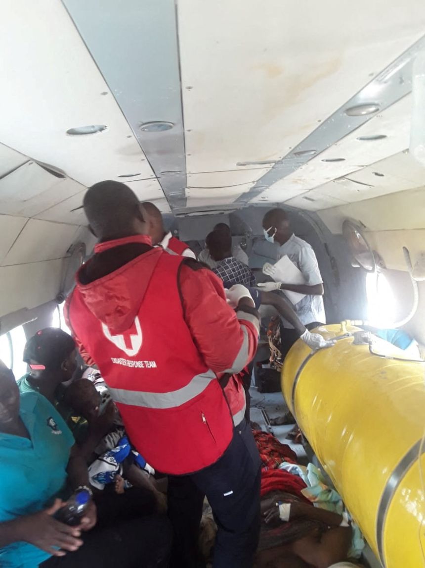 Members of the Kenya Red Cross airlift survivors of a landslide following continuous rainfall that left at least 21 people dead in Chesongoch in Elgeyo-Marakwet County in western Kenya on November 1.