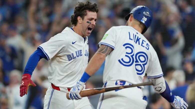 Nov 1, 2025; Toronto, Ontario, CAN; Toronto Blue Jays third baseman Ernie Clement (22) reacts after scoring a run against the Los Angeles Dodgers in the sixth inning for game seven of the 2025 MLB World Series at Rogers Centre. Mandatory Credit: Nick Turchiaro-Imagn Images