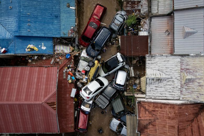 A drone view shows cars piled up after being swept away in floods brought on by Typhoon Kalmaegi which piled up at a subdivision in Bacayan, Cebu City, Philippines, on November 5, 2025.