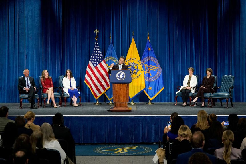 FDA Commissioner Dr. Marty Makary, center, shared the stage with doctors who supported removing the 