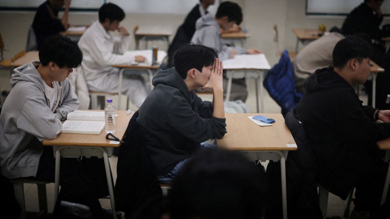 Students wait for the start of the annual college entrance examinations at an exam hall in Seoul, South Korea, November 13, 2025.