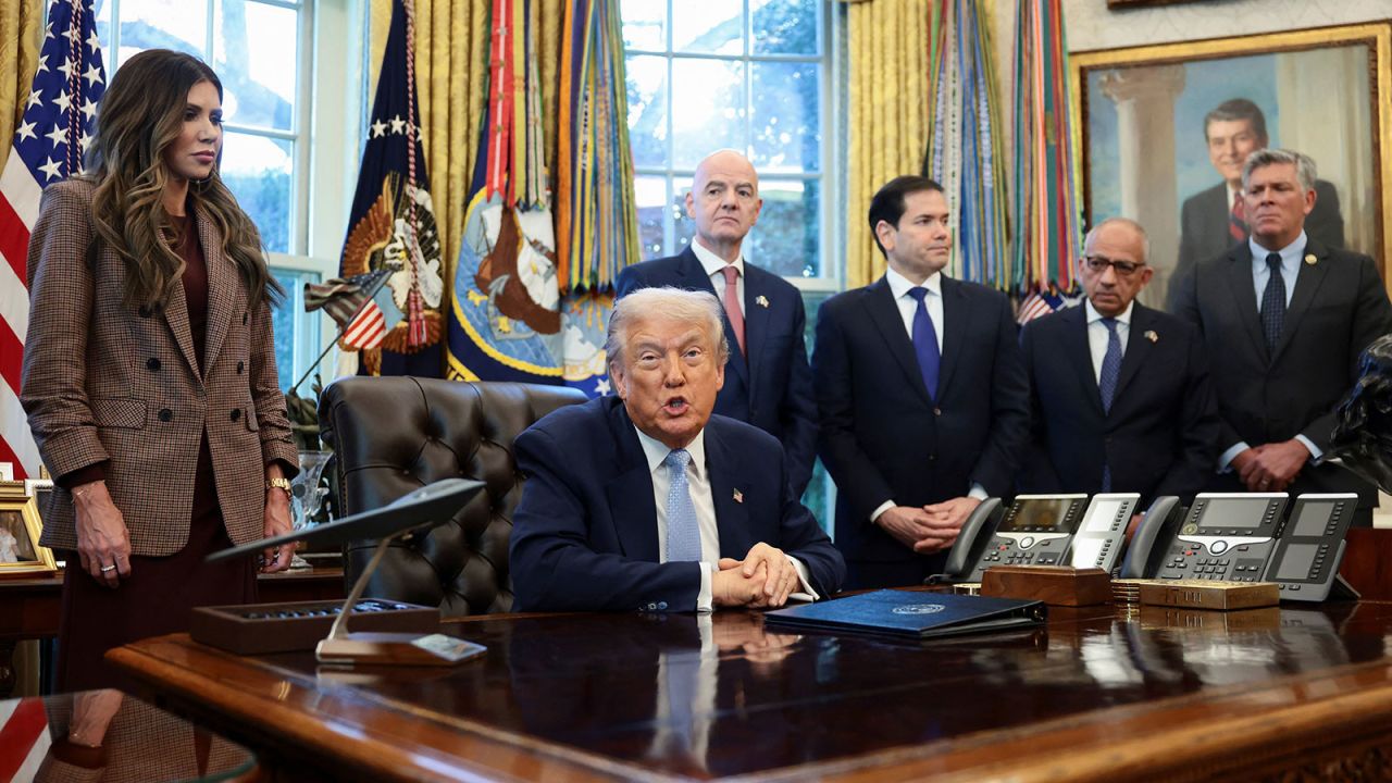 US President Donald Trump speaks while US Homeland Security Secretary Kristi Noem, FIFA President Gianni Infantino, US Secretary of State Marco Rubio, and Senior advisor to FIFA president Carlos Cordeiro stand near him, in the Oval Office at the White House in Washington, DC, on Monday.