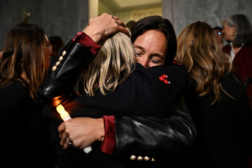 National Director of World Without Exploitation Lauren Hersh embraces Epstein survivor Danielle Bensky as they react to the Senate's passing of the bill to force the release of files related to Epstein in Washington DC, on November 18, 2025.