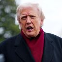 U.S. President Donald Trump speaks to the media while on his way to board Marine One to depart for Joint Base Andrews, from the South Lawn at the White House in Washington, D.C., U.S., November 22, 2025. REUTERS/Aaron Schwartz 