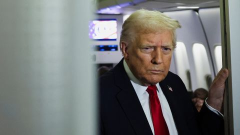 U.S. President Donald Trump looks on aboard Air Force One during travel to Palm Beach, Florida, from Joint Base Andrews, Maryland, on November 25, 2025.