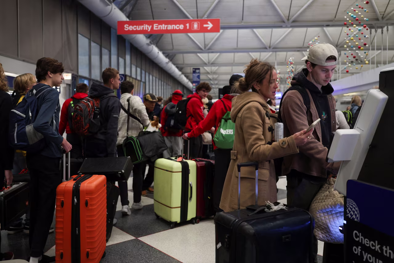 Passengers prepare to board flights at Chicago O'Hare International Airport on Wednesday.