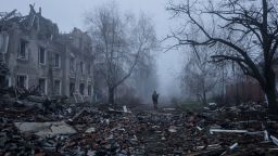 A Ukrainian serviceman walks near apartment buildings damaged by Russian military strike, amid Russia's attack on Ukraine, in the frontline town of Kostiantynivka in Donetsk region, Ukraine November 28, 2025.