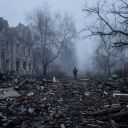 A Ukrainian serviceman walks near apartment buildings damaged by Russian military strike, amid Russia's attack on Ukraine, in the frontline town of Kostiantynivka in Donetsk region, Ukraine November 28, 2025.