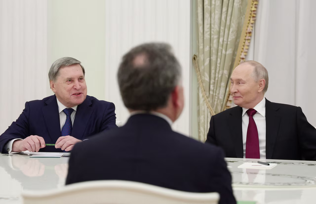 Russian President Vladimir Putin and foreign policy aide Yuri Ushakov, left, attend a meeting with U.S. President Donald Trump's special envoy Steve Witkoff at the Kremlin on Tuesday.