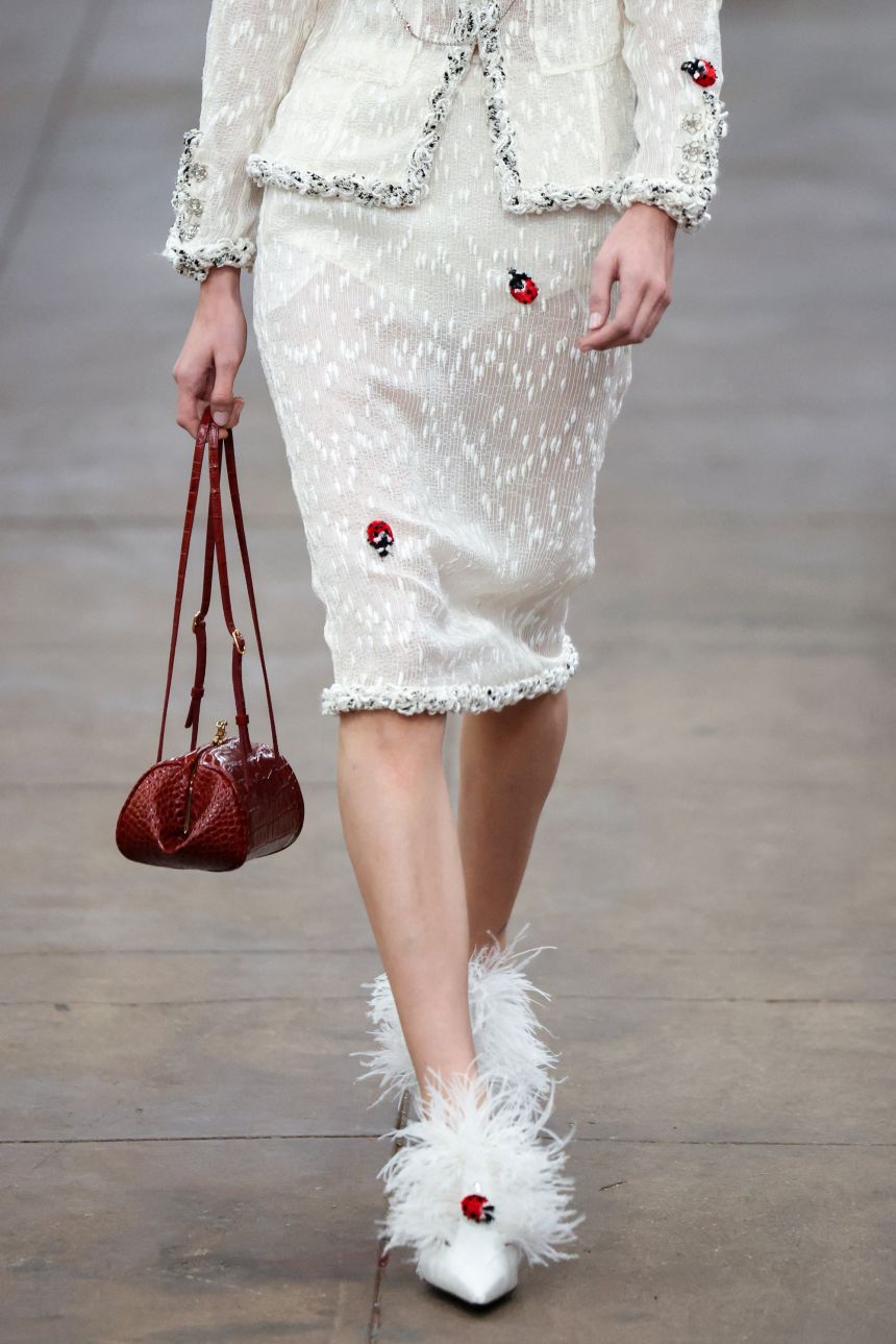 Whimsical details like little lady bugs appeared on this look.