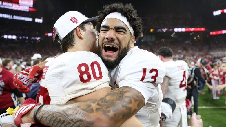 Indiana Hoosiers wide receiver Elijah Sarratt (No. 13) and wide receiver Charlie Becker (No. 80) celebrate after defeating the Ohio State Buckeyes in the 2025 Big Ten championship.
