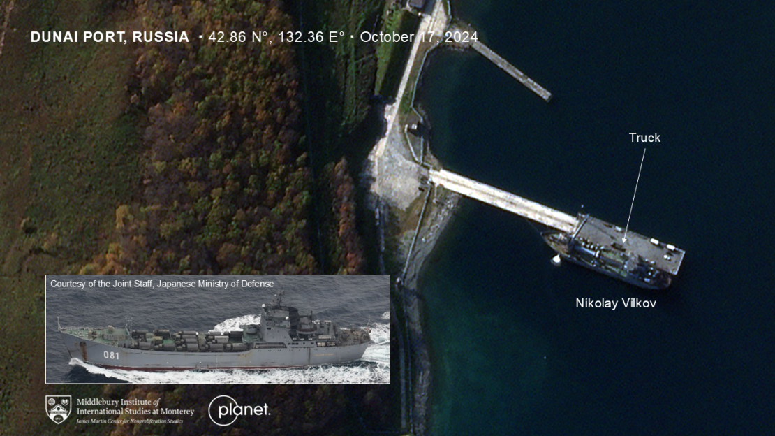 A crane is seen extending to one of Russia’s naval landing ships, which researchers believe is the Nikolay Vilkov, at Dunai port on October 17, and a covered cargo truck is on the dock next to it.