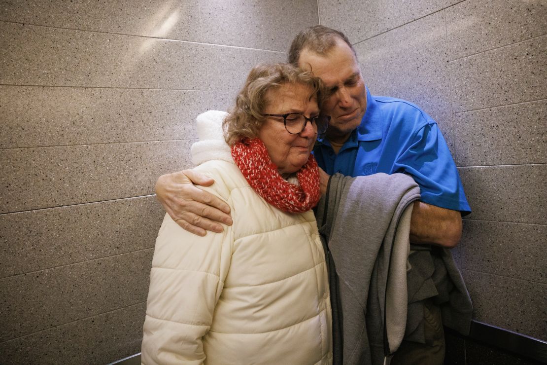 Just a week after the implantation, Tim Andrews was discharged from the hospital. He and his wife, Karen, share a quiet moment as they leave Massachusetts General Hospital.