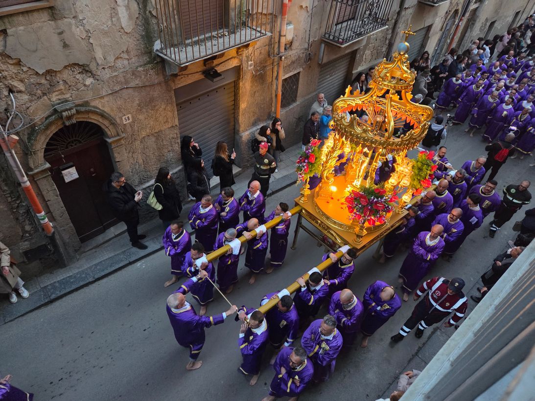 On Good Friday, barefoot celebrants parade through the city carrying Cristo Nero.