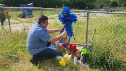 Friend puts cross on Jonathan Joss property