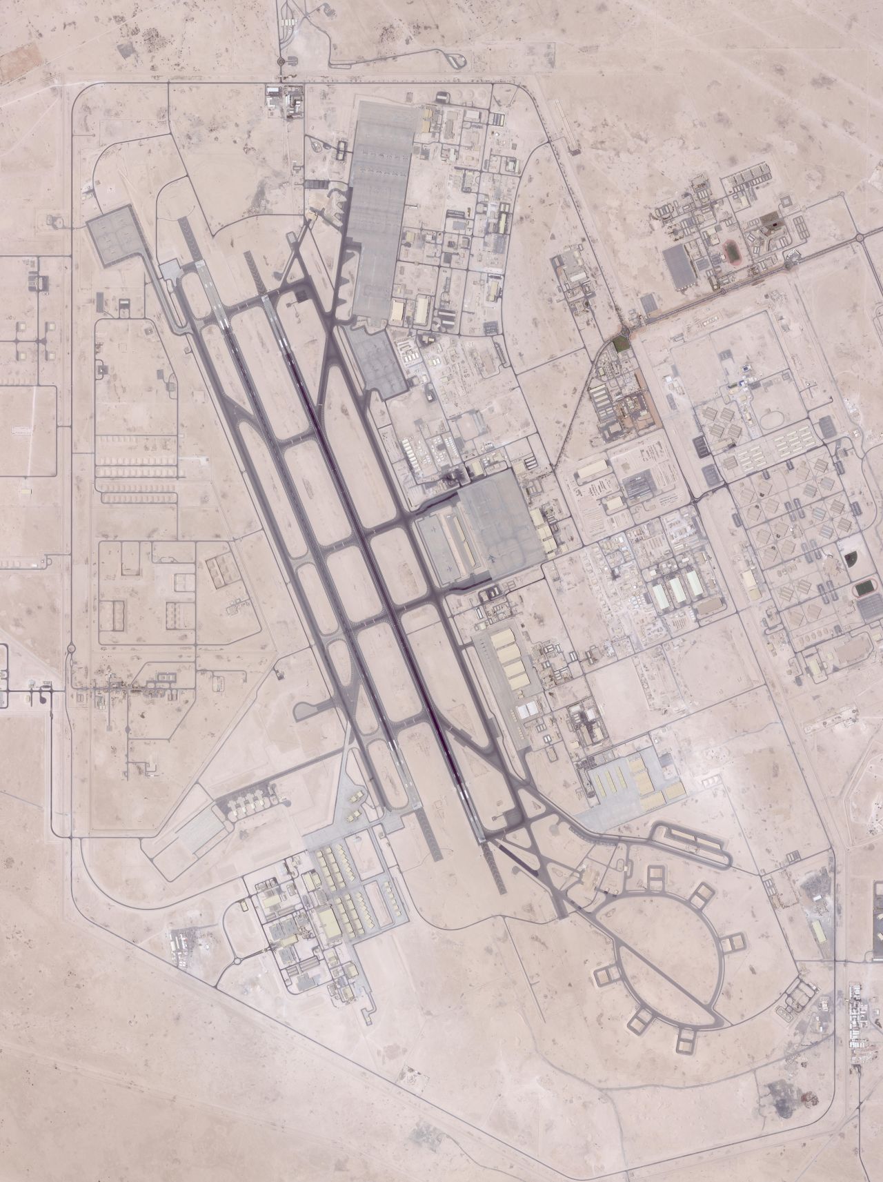 A satellite image shows nearly empty tarmacs at the US military's Al-Udeid Airbase in Qatar after unsheltered aircraft were moved to other locations.