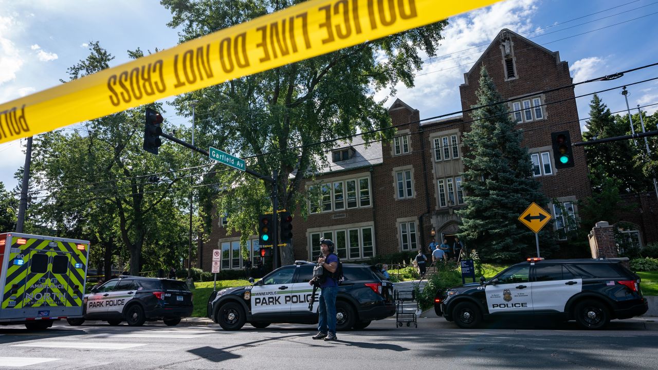Police and emergency response vehicles line the street at Annunciation Catholic Church and School on Wednesday.
