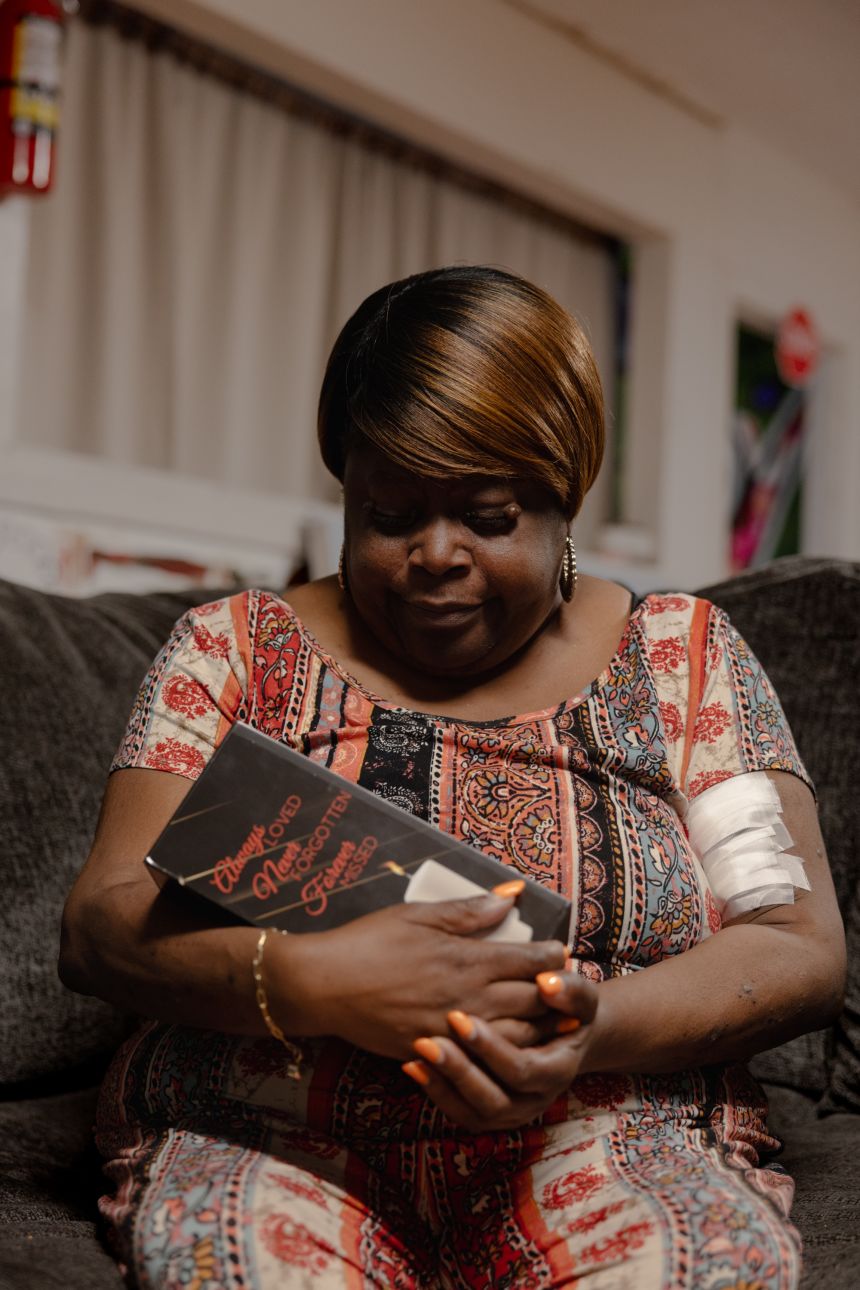 Walker’s mother, Pamela Walker, holds her daughter’s ashes.