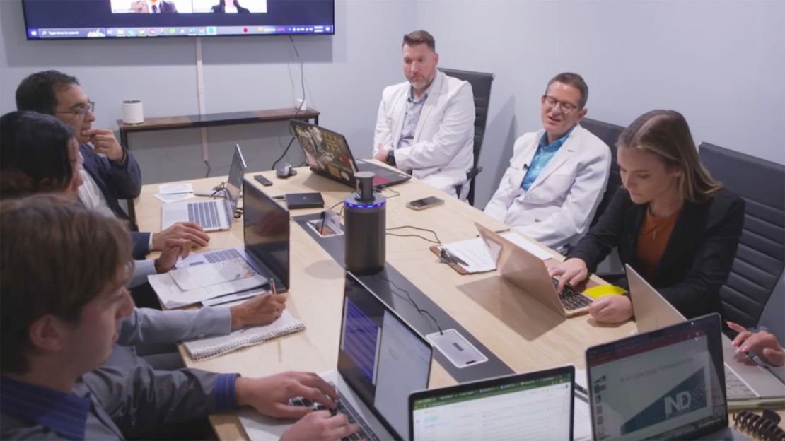 Isaacson, second from right, convenes a panel of experts from all professions to discuss each case.