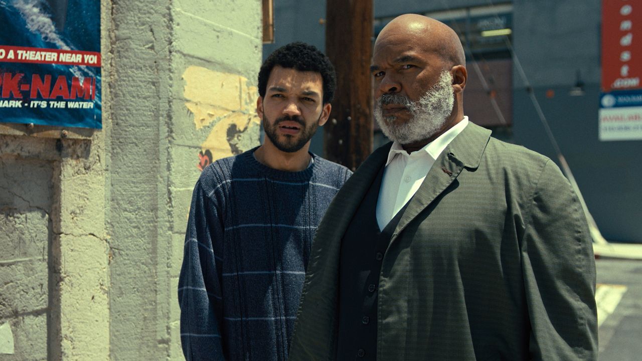 Justice Smith stars as "Aren" and David Alan Grier stars as "Roger" in writer/director Kobi Libii's "The American Society of the Magical Negroes," a Focus Features release.