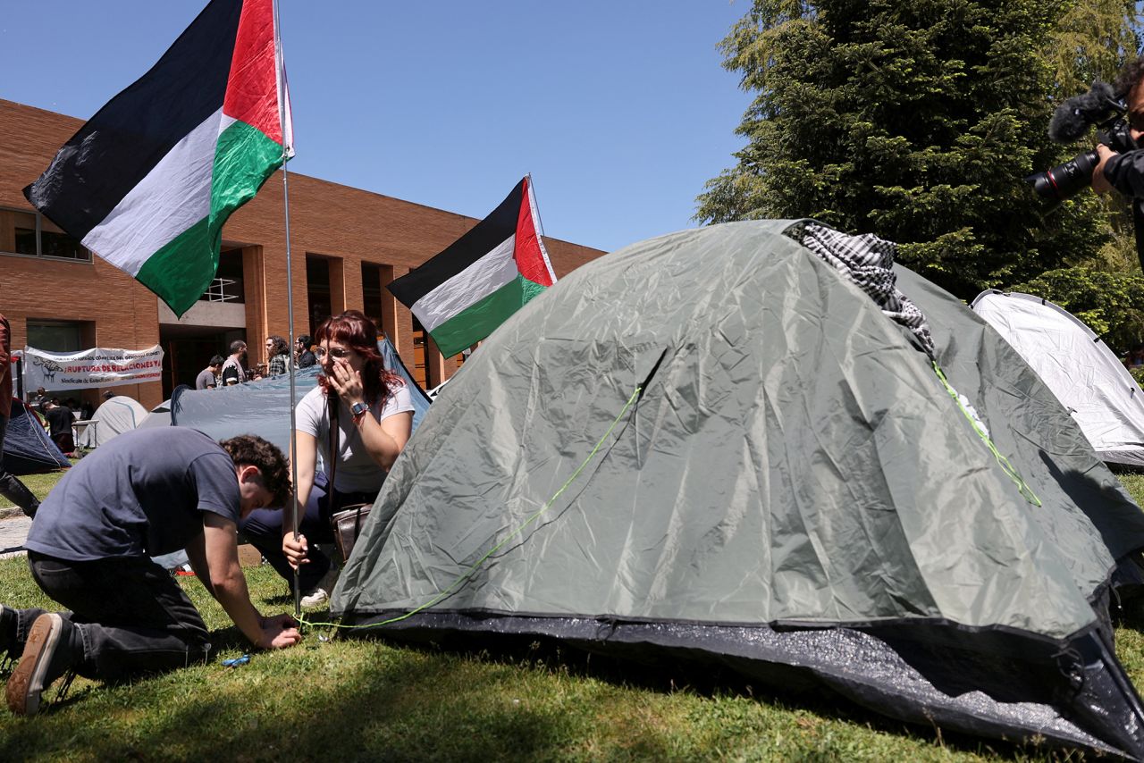 Students of the Complutense University of Madrid place a Palestinian flag beside a tent after setting up a pro-Palestinian encampment in Madrid, Spain, on May 7.