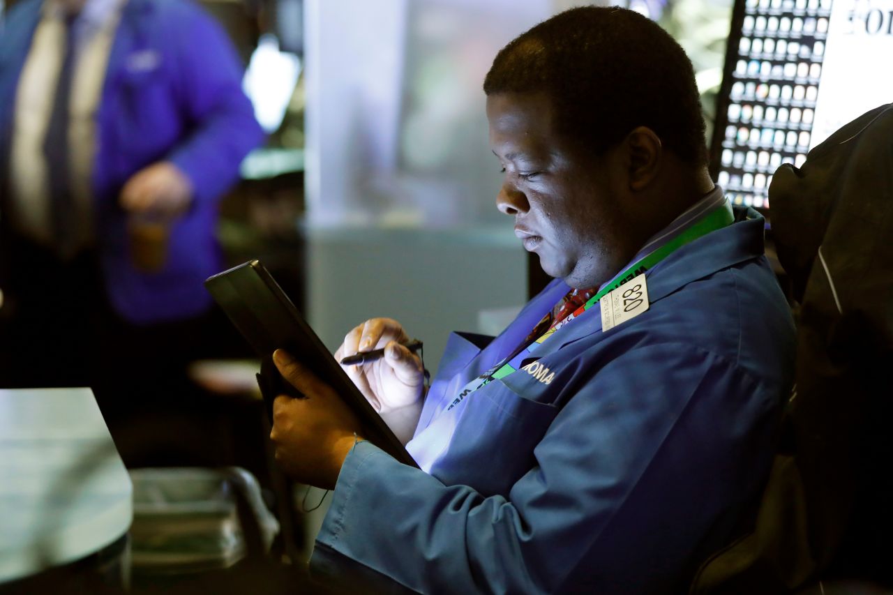 Trader Thomas Lee works on the floor of the New York Stock Exchange, Tuesday, March 10, 2020.