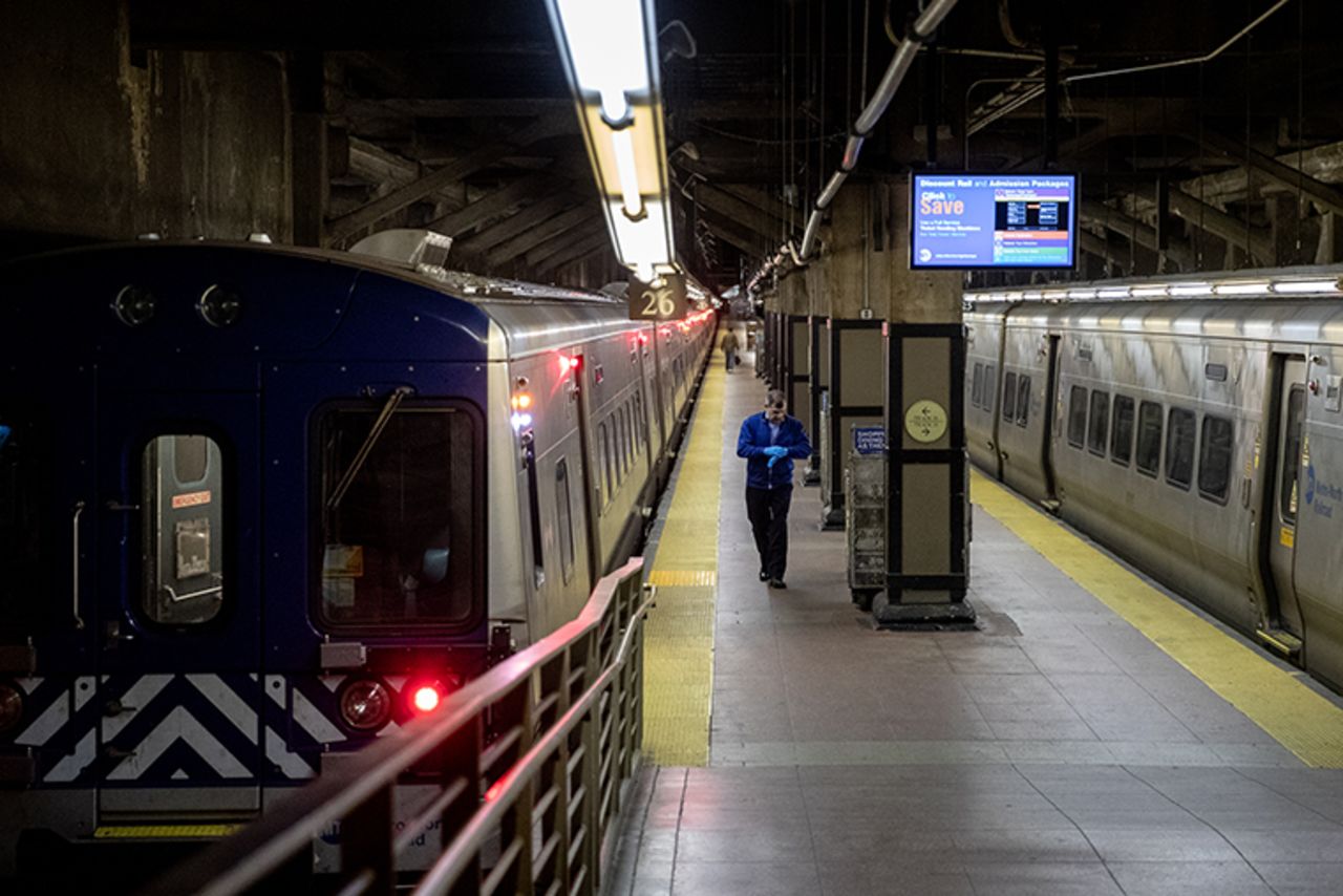 A MTA employee walks along a train platform at Grand Central Station in New York, on Wednesday, April 1.