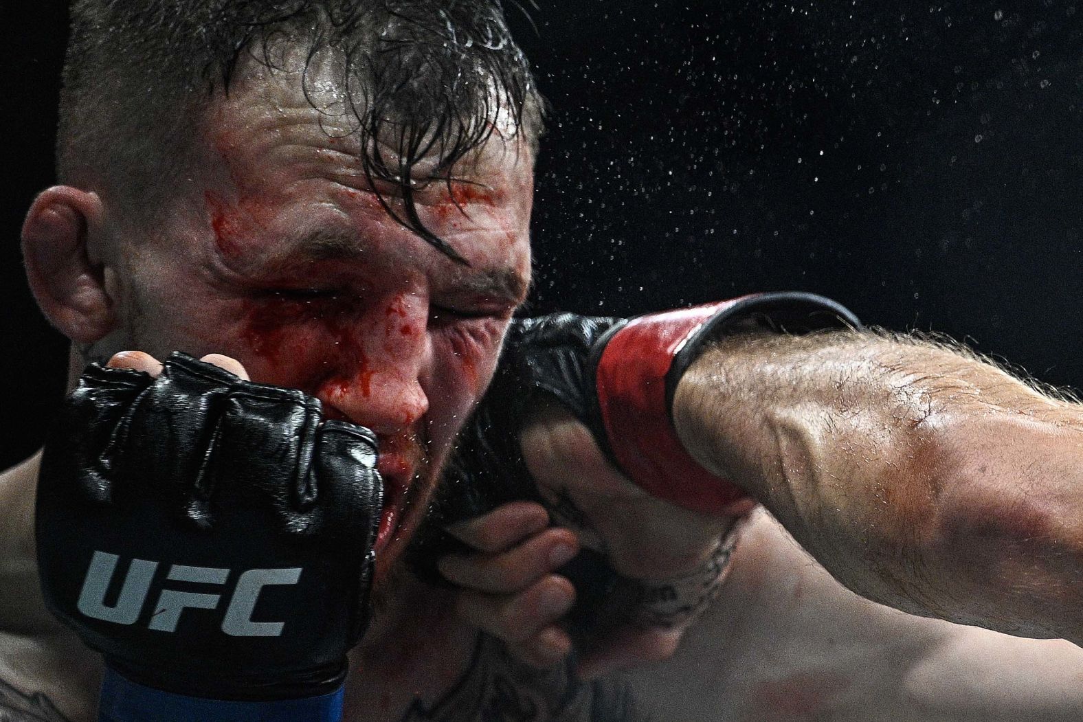 Rhys McKee is punched by Axel Sola during a UFC bout in Paris on Saturday, September 6. Sola won the fight via a third-round stoppage.