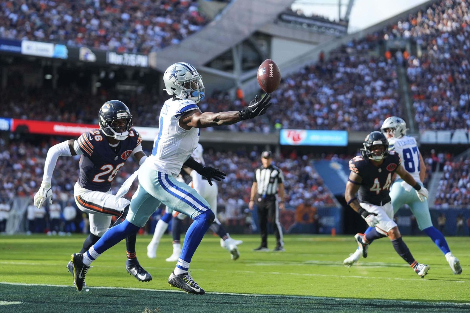 Dallas Cowboys wide receiver George Pickens makes a one-handed touchdown catch during an NFL game against the Chicago Bears on Sunday, September 21.