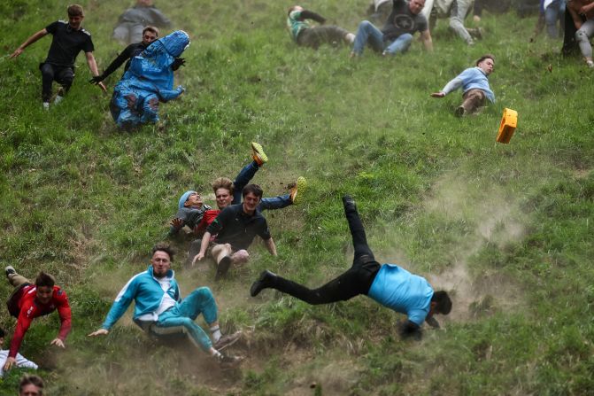 People compete in the Cooper's Hill Cheese-Rolling and Wake competition near Brockworth, England, on Monday, May 26. <a  target="_top" href="/newspapers?url=https://www.cnn.com/2025/05/25/sport/cheese-rolling-coopers-hill-england-spt-intl">It’s been described as the world’s most dangerous race</a>, and it’s certainly one of the most ridiculous — a 200-yard dash after a wheel of Double Gloucester cheese.