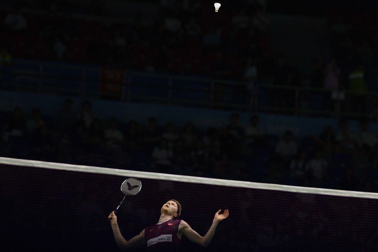Denmark's Anders Antonsen competes against Taiwan's Chou Tien-chen during their semi-final match at the Korea Open badminton tournament in Suwon, South Korea, on Saturday, September 27.