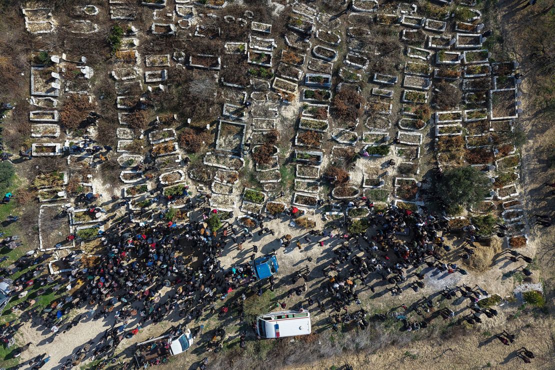 People in the Syrian village of Al-Janoudiya attend a funeral procession Saturday, March 8, for four Syrian security force members who were killed in clashes with loyalists of ousted President Bashar al-Assad. Clashes between government security forces and Assad supporters have killed hundreds this month, according to a monitoring group.