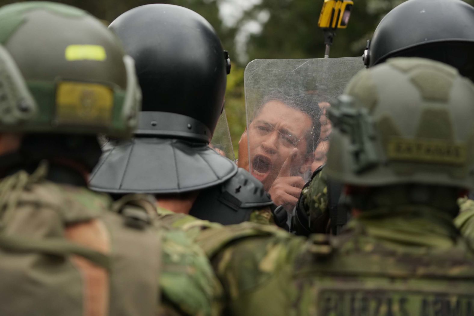 A man faces off with soldiers during an anti-government protest in Quito, Ecuador, on Wednesday, October 15. <a href="index.php?page=&url=https%3A%2F%2Fwww.cnn.com%2F2025%2F10%2F05%2Famericas%2Fecuador-state-of-emergency-protests-intl-latam">Anti-government demonstrations</a> began last month in response to the removal of a fuel subsidy that raised diesel prices from $1.80 to $2.80 per gallon.