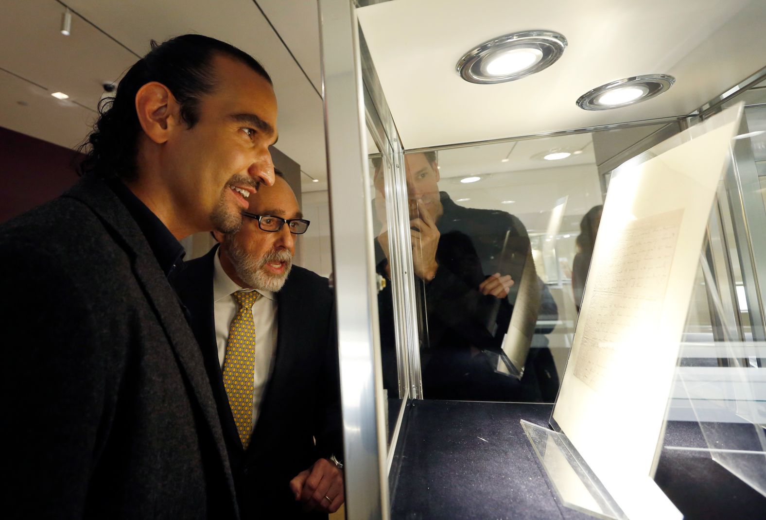 Javier Muñoz, left, examines a letter written by the real-life Alexander Hamilton in January 2017. Muñoz is one of the actors who portrayed him on stage.